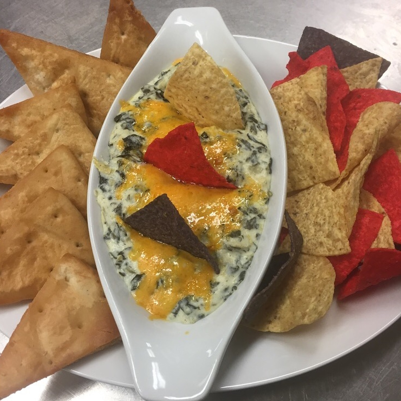Picture of nachos and pita bread with dip
